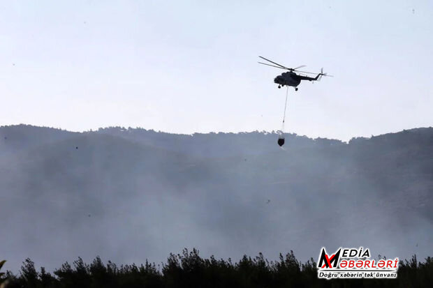 İzmirdə meşə yanğınına müdaxilə edən helikopter su anbarına düşüb - FOTO/VİDEO